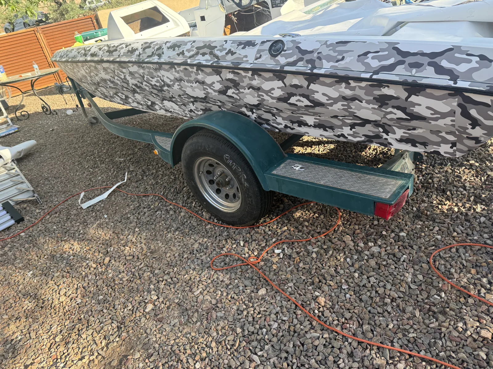 Same boat after custom gray and black camo wrap